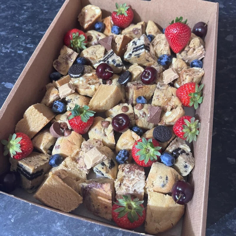 Large event dessert platter featuring 12 artisan loaded cookies cut into 48 wedges with fudgy centers, arranged for catering by Crumbology Cookies in Mandurah.